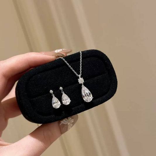 Close-up of Drop Diamond Necklace showing sterling silver chain and pear-cut CZ
